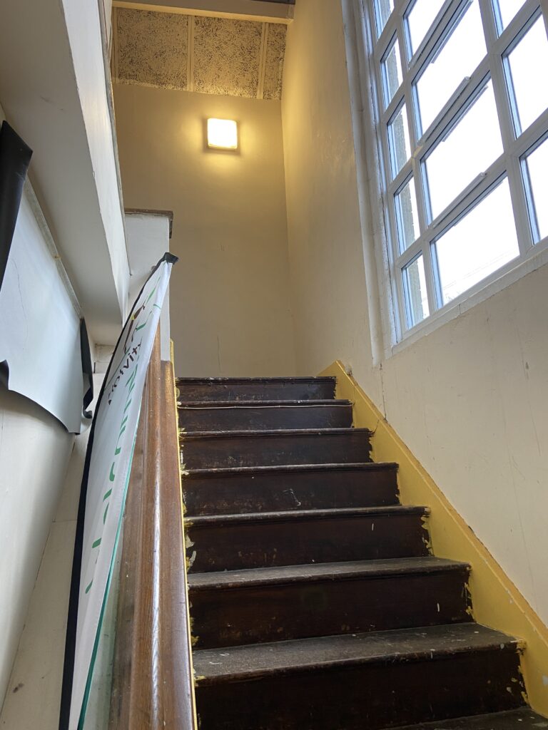 A view up some stairs from the bottom showing no carpet or clutter