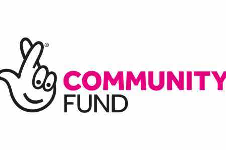 The national lottery community fund logo an image of crossed fingers next to the words Community (in shocking pink) and Fund